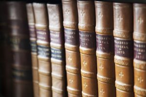 A row of old books on a shelf.