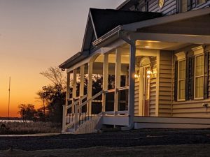 sunset custom home porch water view